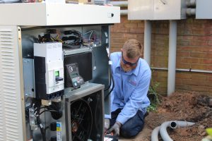 man installing generator 