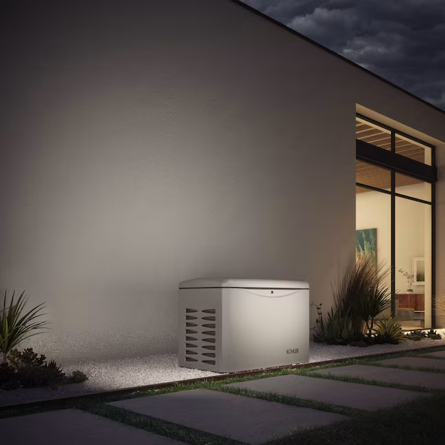 Kohler RCAL 14,000 Watt Dual Fuel Home Standby Generator installed outside a modern home, showcasing its durable design and quiet operation.