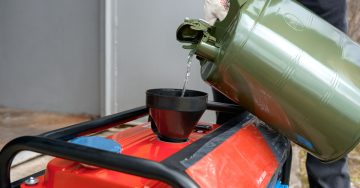 pouring fuel into generator image
